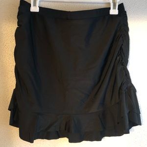 Never worn swim skirt with ruffled detail and built in shorts